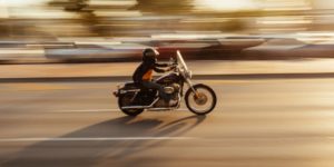What are the odds of surviving a motorcycle accident with and without a helmet